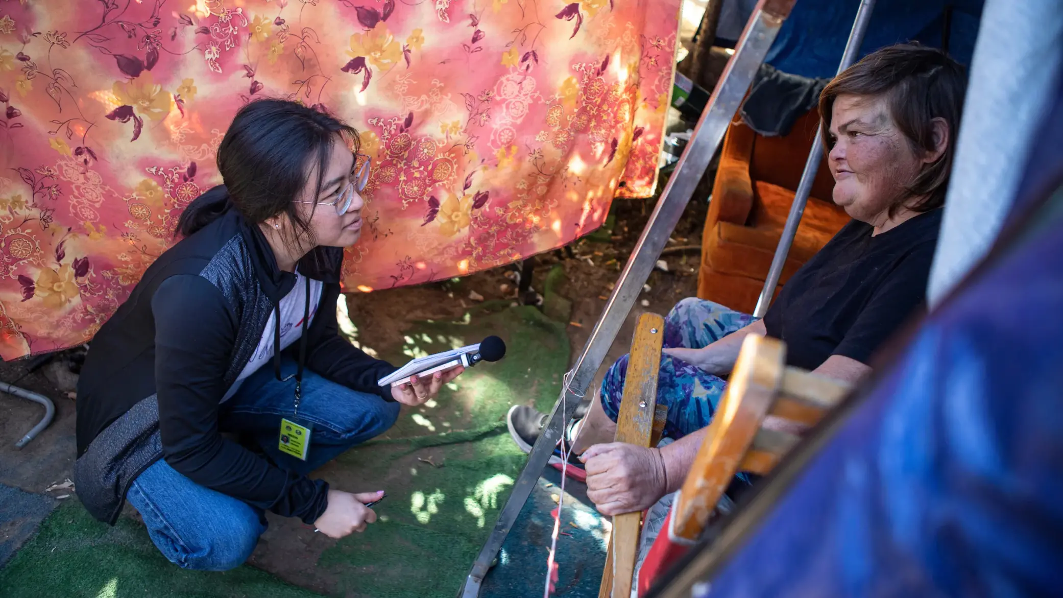 CalMatters reporter Kristen Hwang interviews Carla Bolen at her encampment at the Figueroa St. Viaduct above Highway 101 in Elysian Valley Park in Los Angeles.